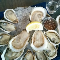 Photo taken at Taylor Shellfish Oyster Bar Queen Anne by Kevin on 6/1/2014