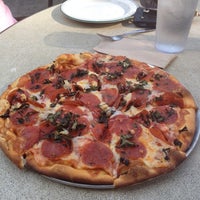 Photo taken at Bazbeaux Pizza by Topher on 10/26/2011