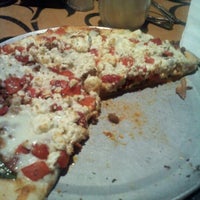 Photo taken at Bazbeaux Pizza by Mallery A. on 2/25/2012